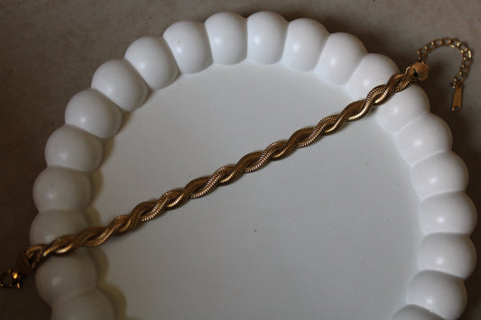 Gold-tone stainless steel twisted rope bracelet with a sleek, textured design. Tarnish-resistant, hypoallergenic, and perfect for layering or solo wear. Elevate your everyday style with this durable, elegant bracelet. Shop fashion jewelry at FashNotch!
