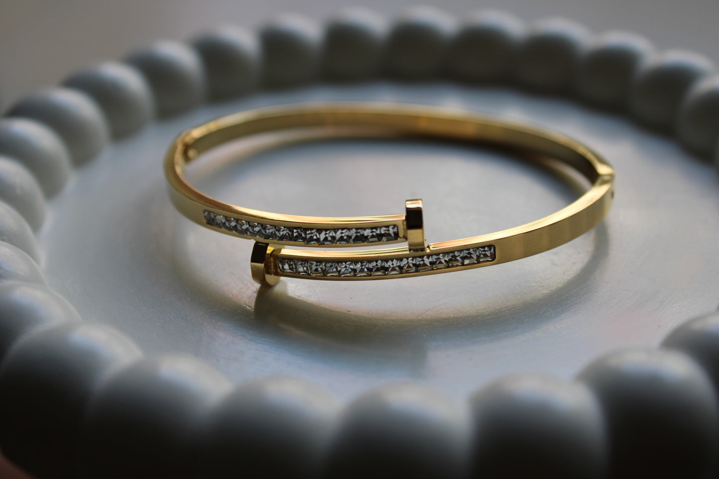 Gold-tone stainless steel bracelet with cubic zirconia accents. Anti-tarnish, hypoallergenic, and perfect for any occasion. Shop premium fashion jewelry at FashNotch!